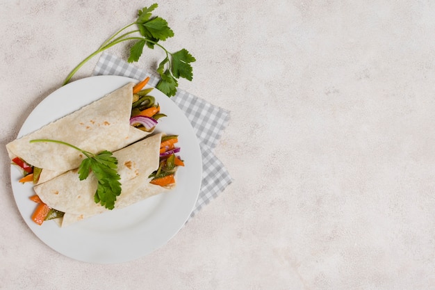 Free Photo flat lay of vegetables wraps with copy space