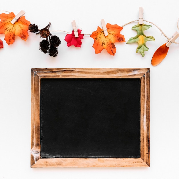 Free Photo flat lay of vintage frame and autumn signs 