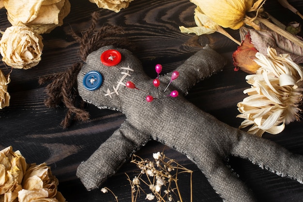 Free Photo flat lay  vodoo doll and flowers arrangement