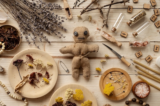 Flat lay voodoo doll and esoteric elements