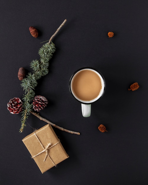 Free photo flat lay warm beverage next to christmas decorations