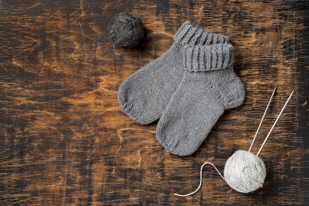 Flat lay warm socks on wooden table