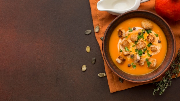 Flat lay of winter squash soup in bowl with copy space