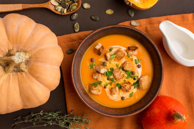 Flat lay of winter squash soup in bowl with croutons