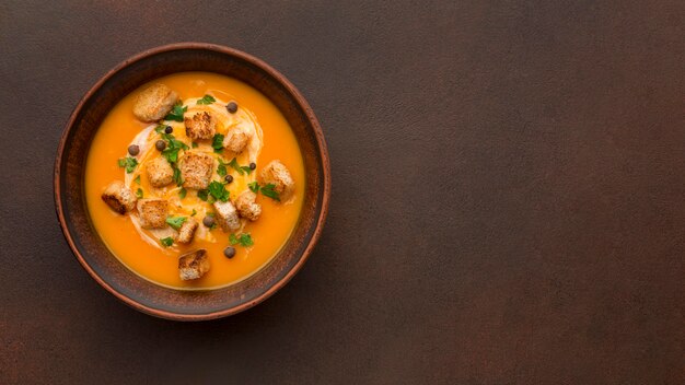 Flat lay of winter squash soup with copy space