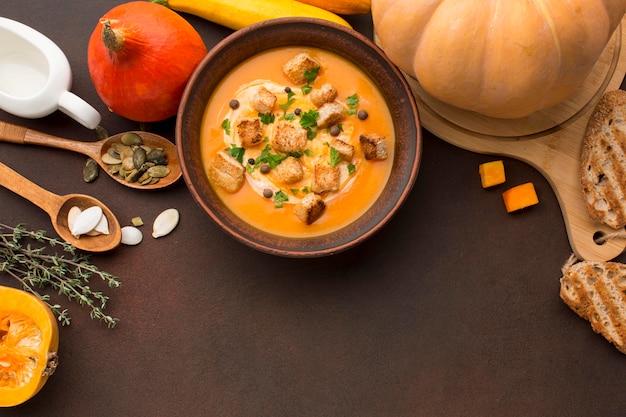 Free Photo flat lay of winter squash soup with croutons in bowl