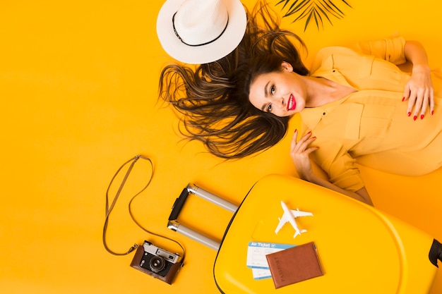 Flat lay of woman with travel essentials