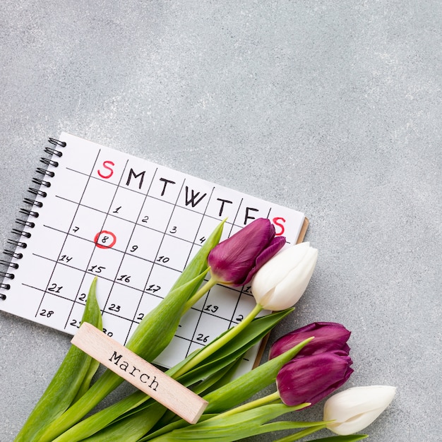 Free Photo flat lay women's day concept composition with calendar