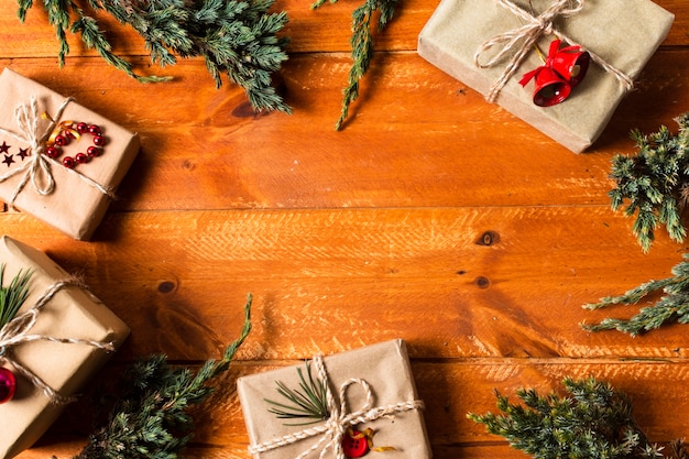 Flat lay wooden background with wrapped gifts