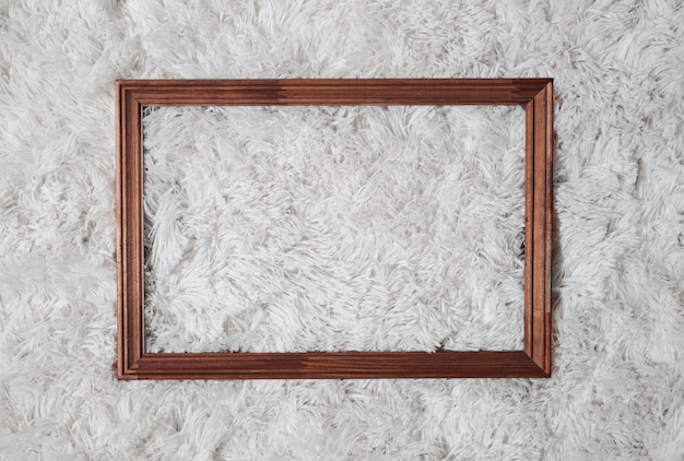 Free Photo flat lay wooden frame on carpet