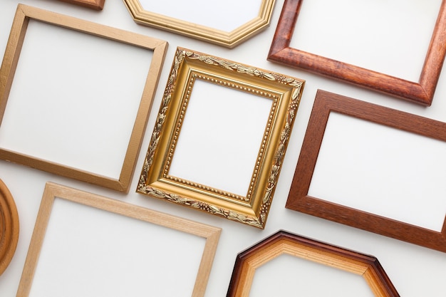 Free photo flat lay of wooden frames arrangement