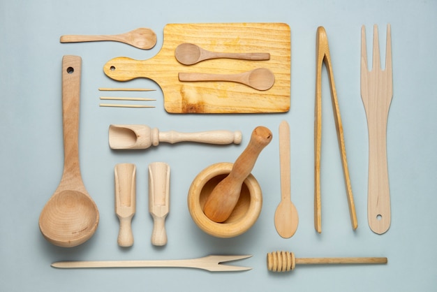 Free photo flat lay wooden kitchen tools assortment