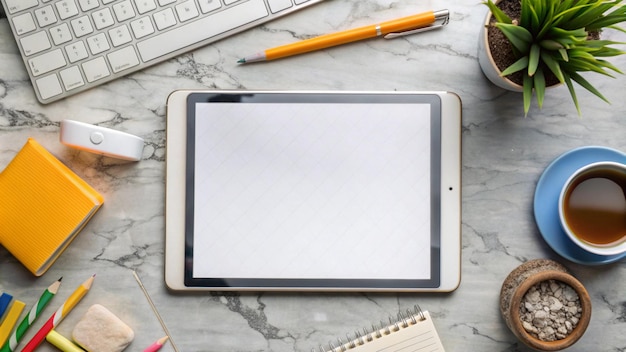 Free Photo flat lay of a workspace with a tablet keyboard pencils and a cup of tea