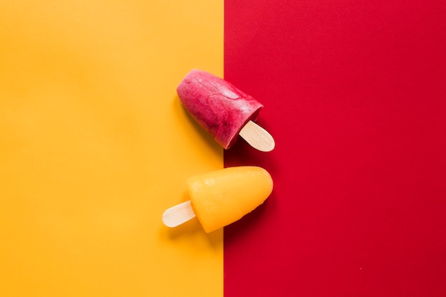 Free photo flat lay of yummy colorful popsicles