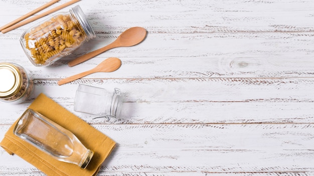 Flat lay zero waste arrangement on wooden background with copy space