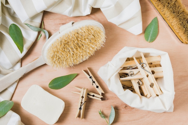 Free photo flat lay zero waste assortment on wooden background with clothespins