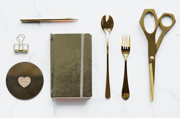 Free photo flatlay of golden utensils decoration concept