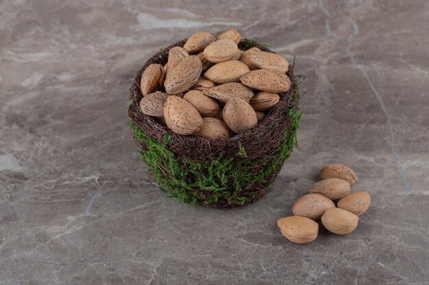 Flavorful almonds in a bowl on the marble surface