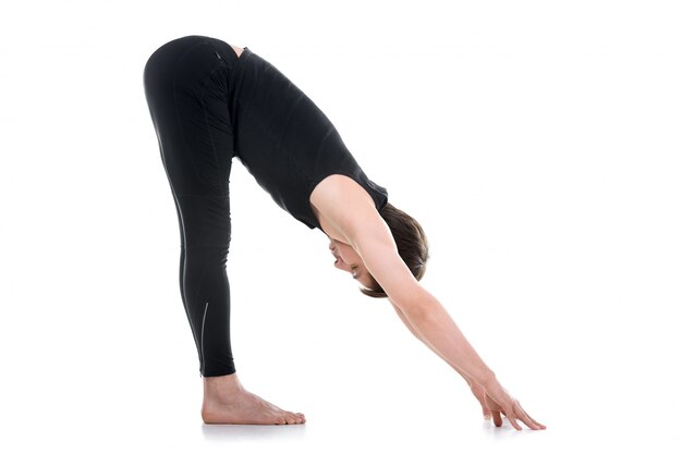 Flexible man doing yoga exercise