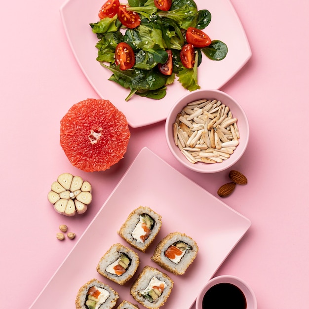 Free photo flexitarian diet with salad and sushi flat lay