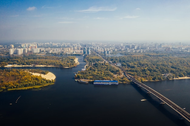 Free photo flight over the bridge in kiev. aerial photography