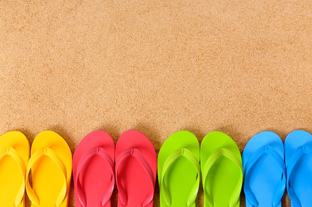 Flip flops on a sandy beach 