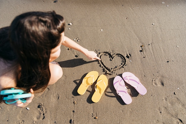 Free photo flip flops and woman at the beach