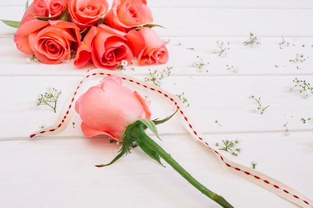 Floral arrangement with salmon rose detached