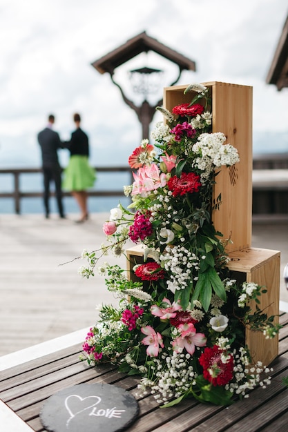 Floral composition posted in a vertical box