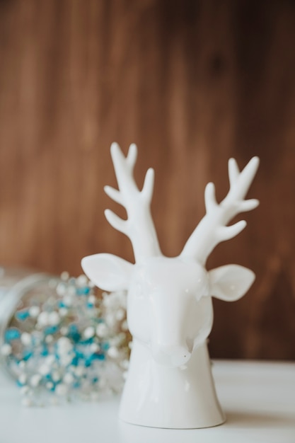 Free photo floral composition with deer statue