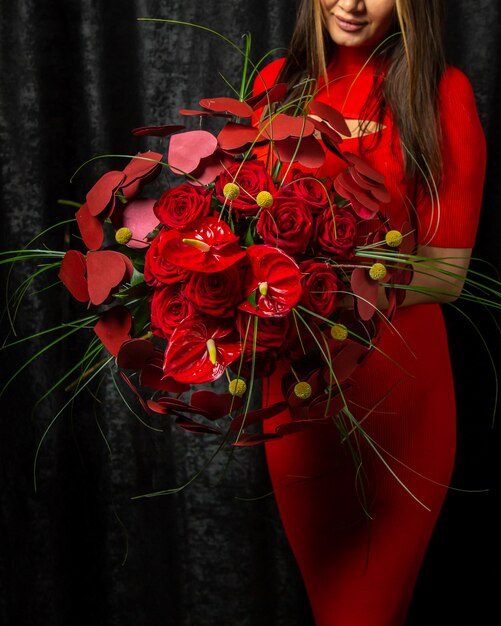 Floral decor woman holding bouquet of anthurium