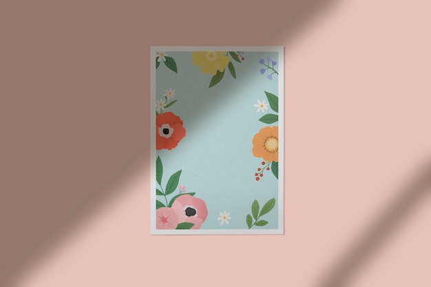 Free photo floral frame against a wall