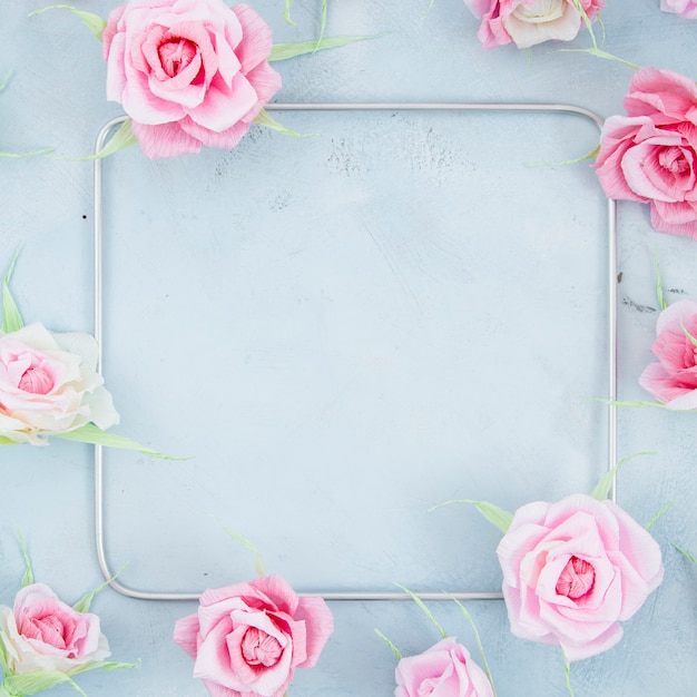 Free photo floral frame with square on cement background