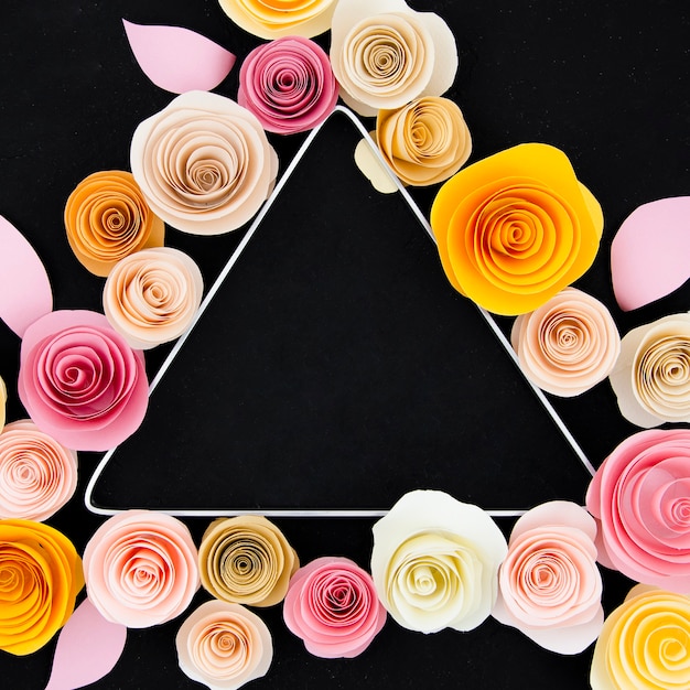 Free photo floral frame with triangle on black background