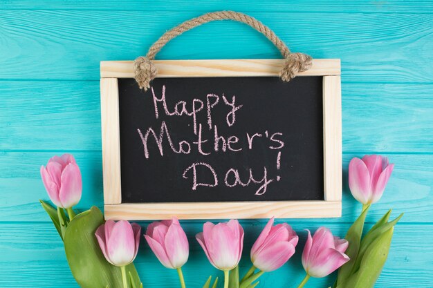 Free Photo floral mothers day composition with slate and flowers