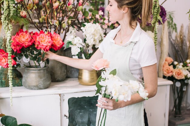 Florist choosing flowers for bouquet