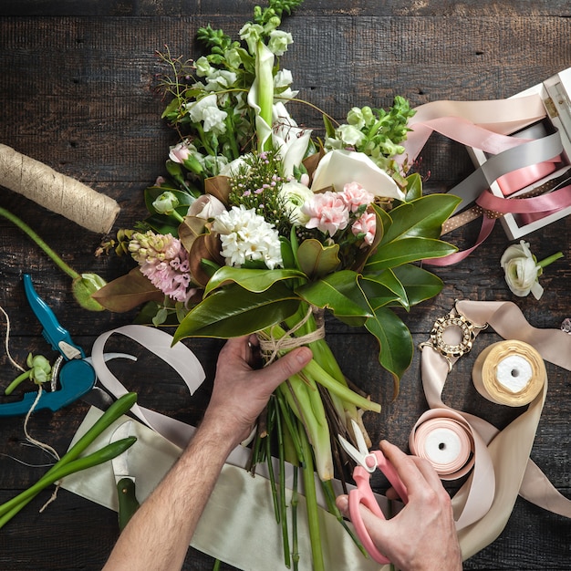 Free Photo florist desktop with working tools and ribbons