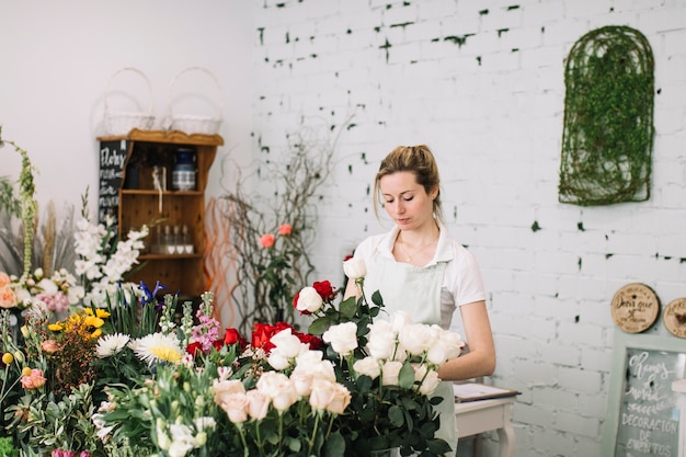 Free photo florist making bouquets at table