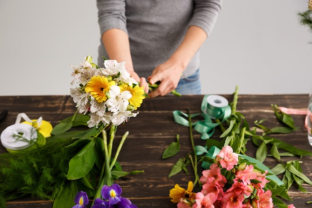 Free Photo florist woman make bouquet from colorful flowers