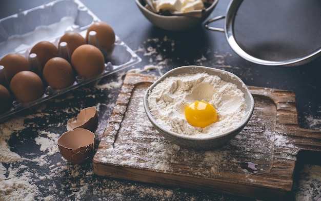 Free Photo flour butter and eggs on the kitchen table closeup