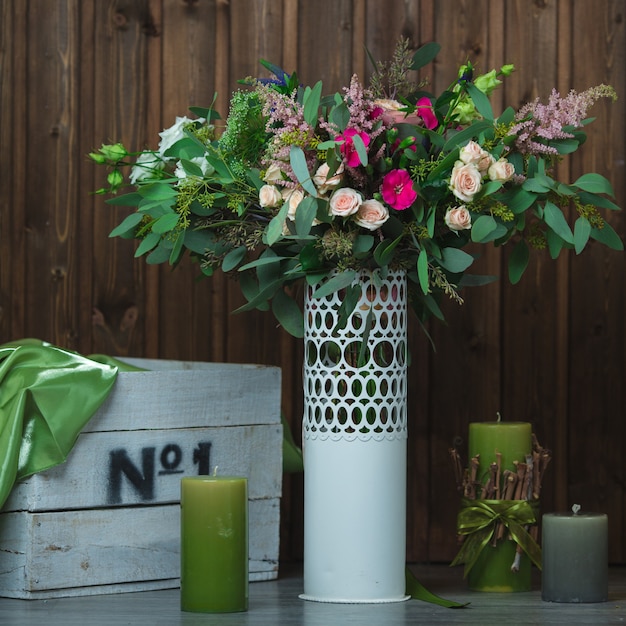 Free photo flower bouquet inside white decorative vase.