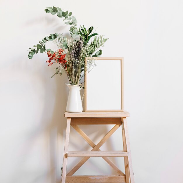 Flower and frame on stool