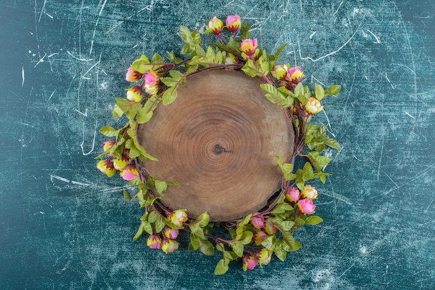 Flowers around the board , on the blue background. High quality photo