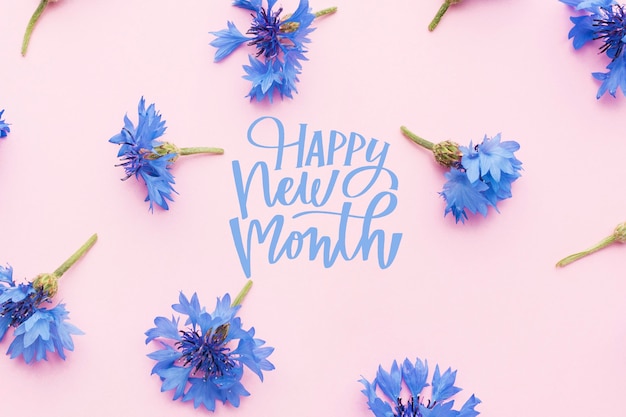 Free photo flowers arrangement with happy new month lettering