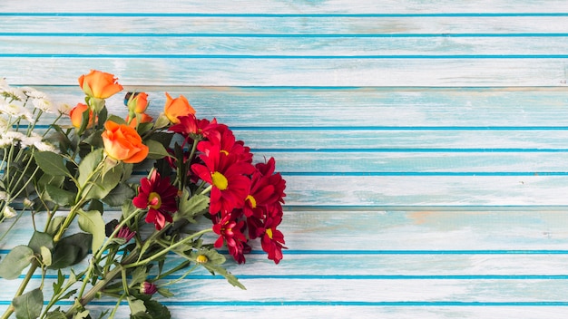 Flowers bouquet on wooden table