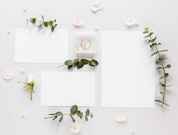 Free photo flowers branches with wedding invitation