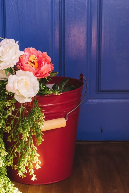 Free photo flowers in bucket