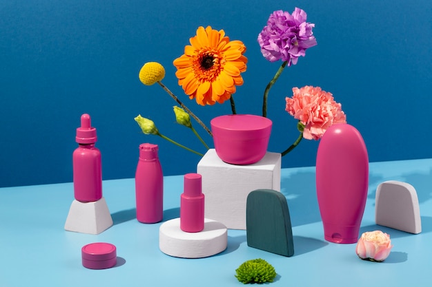 Free photo flowers and cosmetics containers assortment