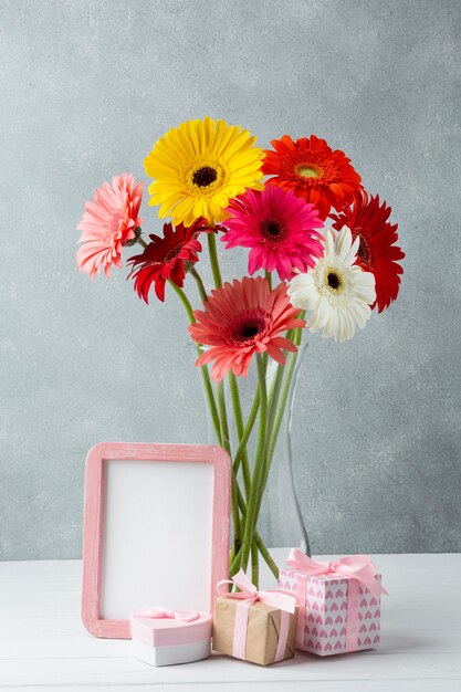 Flowers and gifts on a grey background