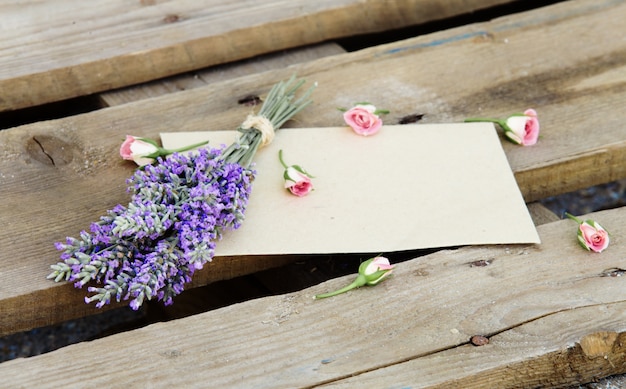 Flowers on wooden background.